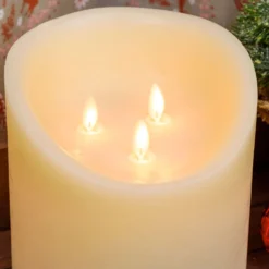 Candela in cera ruvida avorio con 3 fiamme, h 35 cm