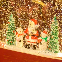 Lanterna in vetro rosso antico, paesaggio con nevicata glitter, h 19 cm, led bianco caldo