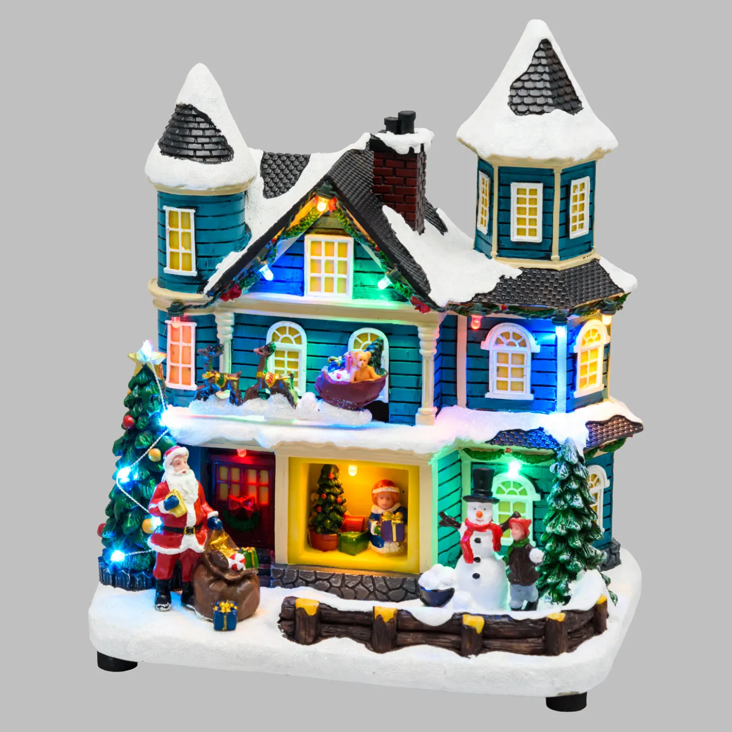 Villaggio di Natale, Casa con scena natalizia, Slitta in movimento e Albero di Natale RGB, h 23 cm, musiche natalizie